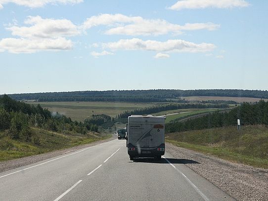 Siberian country road Road in open landscape