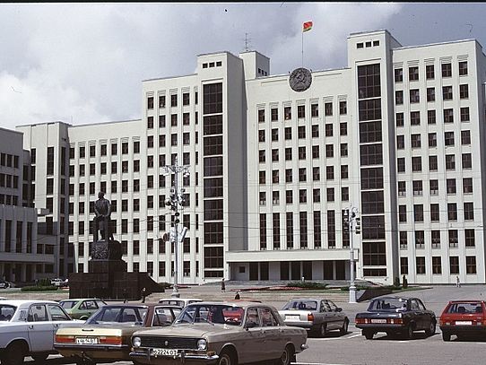 parked vehicles in front of office building 