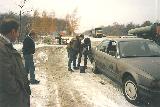 car being filled from petrol can